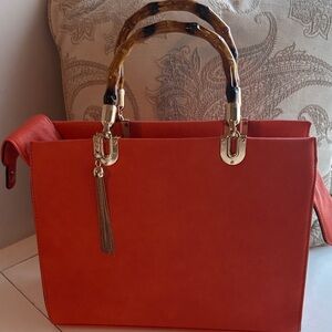 Elegant Orange Handbag with Tortoise Handle